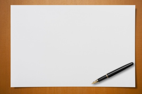 Blank Paper On Desk With A Pen